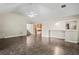 Open living area with high ceilings and views into kitchen at 13600 Ponce De Leon Blvd, Brooksville, FL 34601
