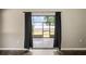 View of backyard through sliding glass doors at 13600 Ponce De Leon Blvd, Brooksville, FL 34601