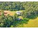 Aerial view of property showing two buildings surrounded by lush green space at 13600 Ponce De Leon Blvd, Brooksville, FL 34601