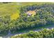 Property with house, outbuildings, and a nearby river at 13600 Ponce De Leon Blvd, Brooksville, FL 34601