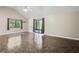 Spacious living room featuring high ceilings and sliding glass doors at 13600 Ponce De Leon Blvd, Brooksville, FL 34601