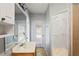 Bathroom with double vanity, walk-in shower, and linen closet at 13600 Ponce De Leon Blvd, Brooksville, FL 34601