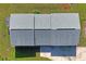 Top-down view of a house with a three-section gray roof at 13600 Ponce De Leon Blvd, Brooksville, FL 34601