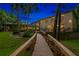 Elevated boardwalk leading to the backyard and pool area at 4300 Wheatland Way, Palm Harbor, FL 34685