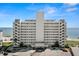 Stunning waterfront condominium building featuring private balconies and breathtaking ocean views on a clear day at 7000 Beach Plz # 505, St Pete Beach, FL 33706