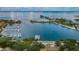 An aerial view showcases a picturesque marina with numerous boats docked in clear blue water at 777 3Rd N Ave # 908, St Petersburg, FL 33701