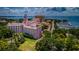 An aerial view showcases a luxury hotel near a marina filled with sailboats in a waterfront setting at 777 3Rd N Ave # 908, St Petersburg, FL 33701