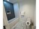 Chic bathroom featuring a modern tub, subway tile, and a contemporary toilet at 777 3Rd N Ave # 908, St Petersburg, FL 33701