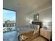 Bedroom with modern decor, bedside tables, and a large window offering city views at 777 3Rd N Ave # 908, St Petersburg, FL 33701
