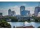A serene lake view showcases the city skyline, complete with lush trees and a fountain at 777 3Rd N Ave # 908, St Petersburg, FL 33701