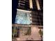 Modern condominium exterior showcasing unique mural and inviting entrance, complete with ambient lighting at 777 3Rd N Ave # 908, St Petersburg, FL 33701