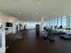 Large modern gym with cardio and weight machines, and skyline views at 777 3Rd N Ave # 908, St Petersburg, FL 33701