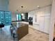 Sleek, modern kitchen with stainless steel appliances and quartz countertop island at 777 3Rd N Ave # 908, St Petersburg, FL 33701