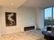 Bright living room features modern fireplace and large windows with city view at 777 3Rd N Ave # 908, St Petersburg, FL 33701