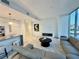 Spacious living room with open layout, marble flooring, and a modern electric fireplace at 777 3Rd N Ave # 908, St Petersburg, FL 33701