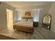 The modern main bedroom features marble floors, a wood bed frame, and lots of natural light at 777 3Rd N Ave # 908, St Petersburg, FL 33701