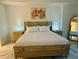 This main bedroom boasts marble floors and two night stands with matching lamps at 777 3Rd N Ave # 908, St Petersburg, FL 33701