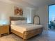 This primary bedroom boasts a modern bed frame, marble floors and views of the city skyline at 777 3Rd N Ave # 908, St Petersburg, FL 33701