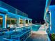 Relaxing rooftop pool featuring cozy lounge areas and beautiful city views at night at 777 3Rd N Ave # 908, St Petersburg, FL 33701