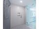 Modern shower space featuring tiled walls, overhead shower head and glass door at 777 3Rd N Ave # 908, St Petersburg, FL 33701