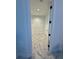 Spacious walk-in closet with modern design and white wire shelving with tile floors at 777 3Rd N Ave # 908, St Petersburg, FL 33701