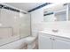 Clean bathroom with a tub shower combo, vanity, and grab bar at 2462 Brazilia Dr # 38, Clearwater, FL 33763