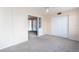 Bright bedroom with carpet flooring, built-in shelving, and double closets at 2462 Brazilia Dr # 38, Clearwater, FL 33763