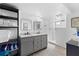 Modern bathroom with gray vanity, marble countertops, and walk-in shower at 489 Wood St, Dunedin, FL 34698