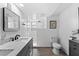 Modern bathroom with gray vanity, marble countertop and walk-in shower at 489 Wood St, Dunedin, FL 34698