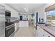 Modern kitchen with stainless steel appliances and wood countertops at 489 Wood St, Dunedin, FL 34698