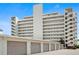 Exterior view of condo building showcasing garage parking at 7000 Beach Plz # 505, St Pete Beach, FL 33706