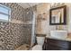 Updated bathroom with a walk-in shower, vessel sink, and granite countertop at 18399 Gulf Blvd # 372, Indian Shores, FL 33785