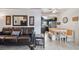 Living room with leather sofa and adjacent kitchen at 18399 Gulf Blvd # 372, Indian Shores, FL 33785