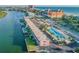 Aerial view of condo complex with pool and waterway access at 18399 Gulf Blvd # 372, Indian Shores, FL 33785