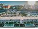 Aerial view of condo complex with pool and shuffleboard at 18399 Gulf Blvd # 372, Indian Shores, FL 33785