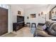 Cozy living room featuring a leather sofa and large TV at 18399 Gulf Blvd # 372, Indian Shores, FL 33785