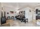 Cozy living room with a leather sofa and tiled floors, open to kitchen at 18399 Gulf Blvd # 372, Indian Shores, FL 33785