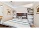 Bedroom with a queen bed and built-in shelves at 18399 Gulf Blvd # 372, Indian Shores, FL 33785