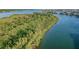 Aerial view of waterfront property with lush vegetation at 18399 Gulf Blvd # 372, Indian Shores, FL 33785