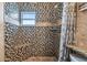 Large walk-in shower with mosaic tile and built-in seat at 18399 Gulf Blvd # 372, Indian Shores, FL 33785
