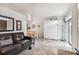 Cozy living room featuring a leather sofa and a Murphy bed at 18399 Gulf Blvd # 372, Indian Shores, FL 33785