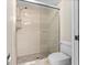 Updated bathroom with a walk-in shower and tile flooring at 3856 Goldfinch Ct, Palm Harbor, FL 34685