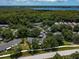 Community overview with houses, roads, and trees at 3856 Goldfinch Ct, Palm Harbor, FL 34685