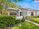 Inviting exterior of a charming villa with lush landscaping at 3856 Goldfinch Ct, Palm Harbor, FL 34685