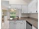 Bright kitchen features granite countertops and updated appliances at 3856 Goldfinch Ct, Palm Harbor, FL 34685
