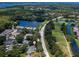 Aerial view of condo community near a road and lush landscaping at 3856 Goldfinch Ct, Palm Harbor, FL 34685