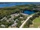 Aerial view of waterfront community with lush landscaping at 3856 Goldfinch Ct, Palm Harbor, FL 34685