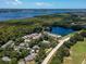Aerial view showing home's location in a quiet community by the lake at 3856 Goldfinch Ct, Palm Harbor, FL 34685