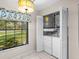 Convenient laundry room with washer, dryer, and storage at 3856 Goldfinch Ct, Palm Harbor, FL 34685