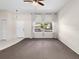 Living room showcasing neutral decor and a large window at 3856 Goldfinch Ct, Palm Harbor, FL 34685